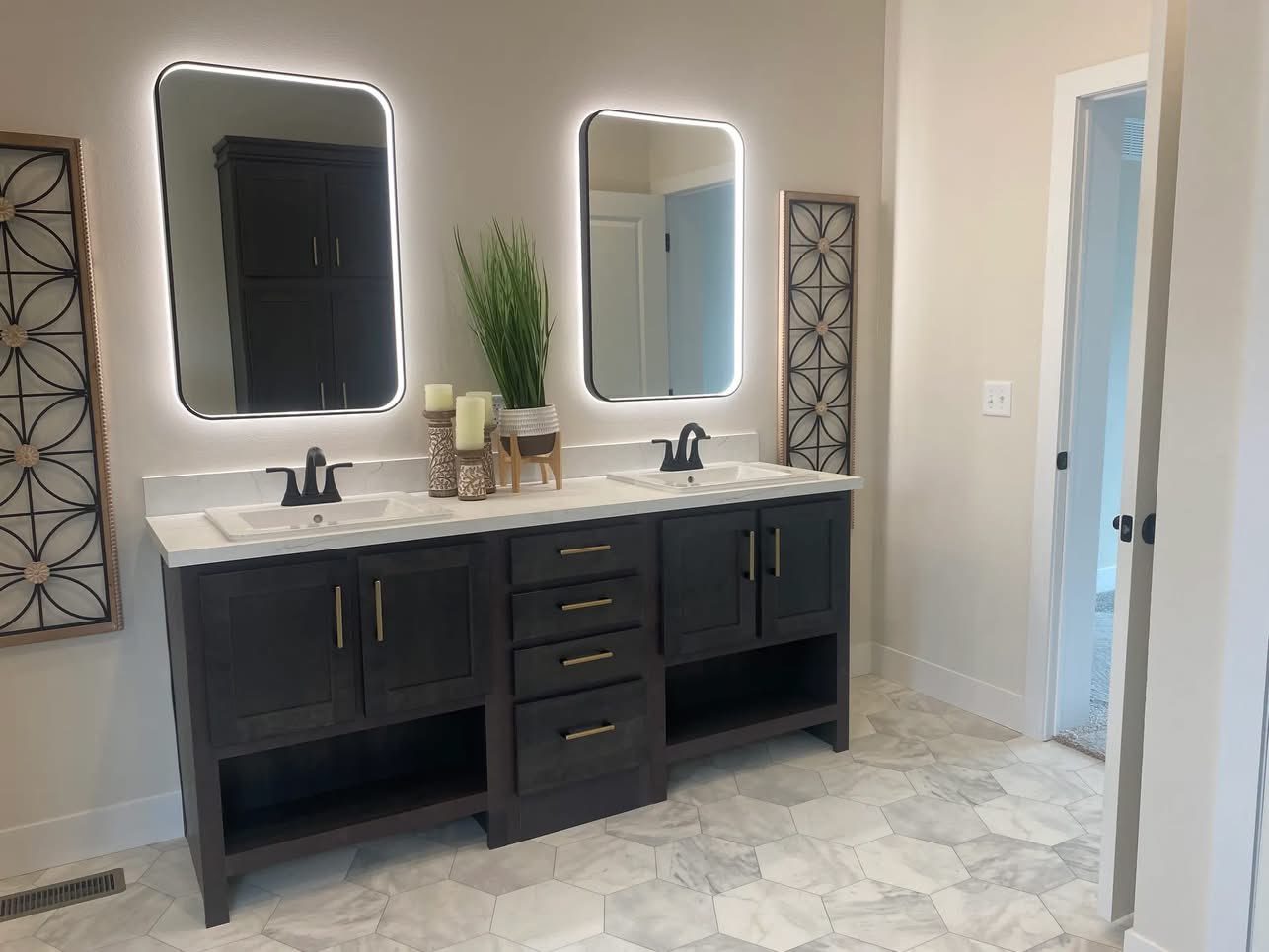 Modern bathroom with dark wood double vanity, white countertop, two backlit mirrors, and decorative panels. Clean, elegant, and minimalist design.