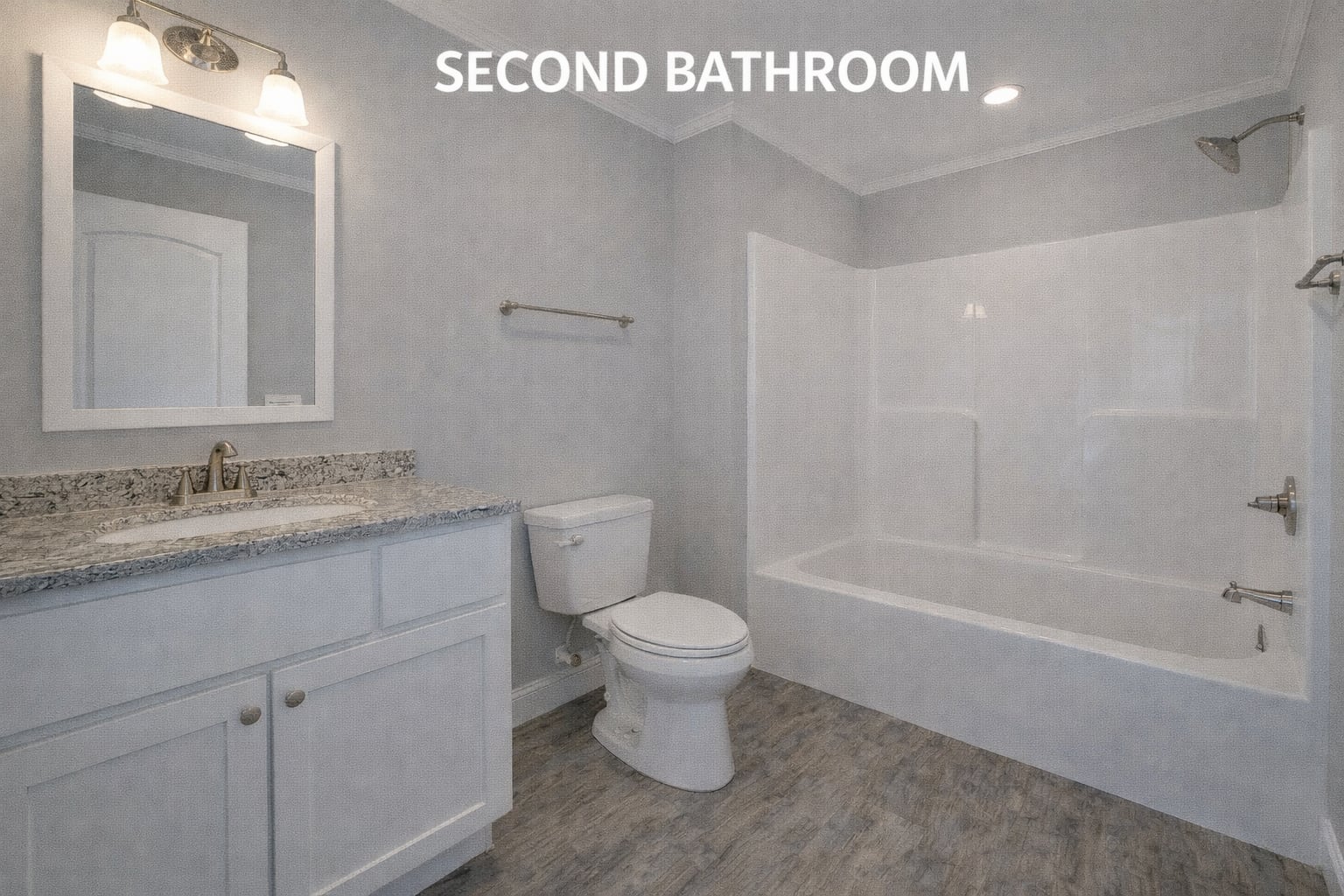 A modern bathroom with light gray walls, wood-look flooring, and labeled "Second Bathroom." Features a white bathtub-shower combo, toilet, and a granite-topped vanity with a mirror and lights, creating a clean, serene atmosphere.