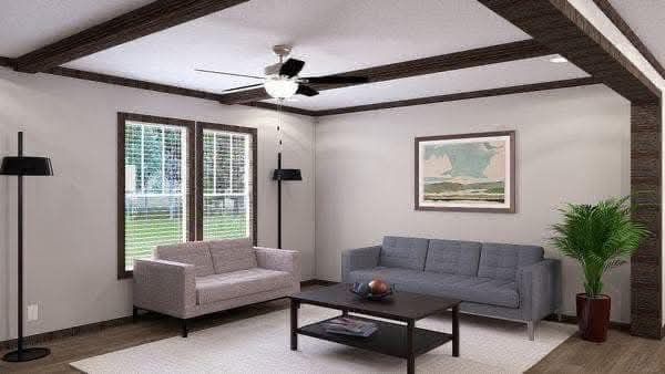 A modern living room with two sofas, one pink and one gray, a wooden coffee table, a standing lamp, a ceiling fan, and a large plant, creating a cozy vibe.