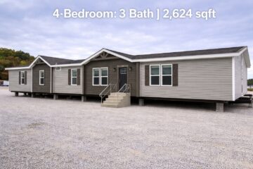 Large modular home with beige siding and dark trim, featuring a front porch with steps. Text: "4-Bedroom: 3 Bath | 2,624 sqft." set against a cloudy sky.