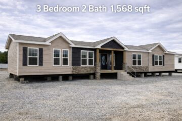 A beige and brown manufactured home on a gravel lot with gabled roofs and a front porch, labeled "3 Bedroom 2 Bath 1,568 sqft" at the top.
