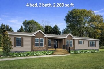 Single-story home with beige siding and brick accents, surrounded by trees and lawn, featuring four bedrooms and two bathrooms. Bright, serene setting.