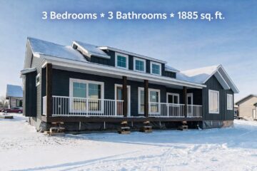 A modern blue-gray house on a snowy landscape, featuring a white-railed porch and slanted roof. Text overlay: "3 Bedrooms, 3 Bathrooms, 1885 sq. ft."
