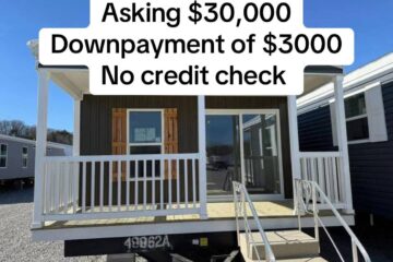 A small, brown mobile home with a white front porch and stairs. Overlay text reads, "Asking $30,000, Downpayment of $3000, No credit check."