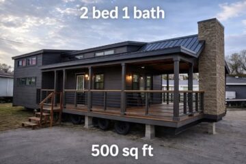 Modern tiny house with dark siding and a covered porch, featuring wood accents and a stone chimney. Text reads: "2 bed 1 bath, 500 sq ft."
