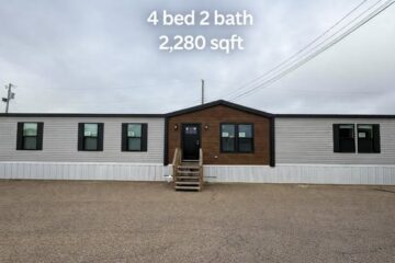 Single-story modular home with gray siding and a brown accent around the entrance. Text states "4 bed 2 bath, 2,280 sqft." Overcast sky.