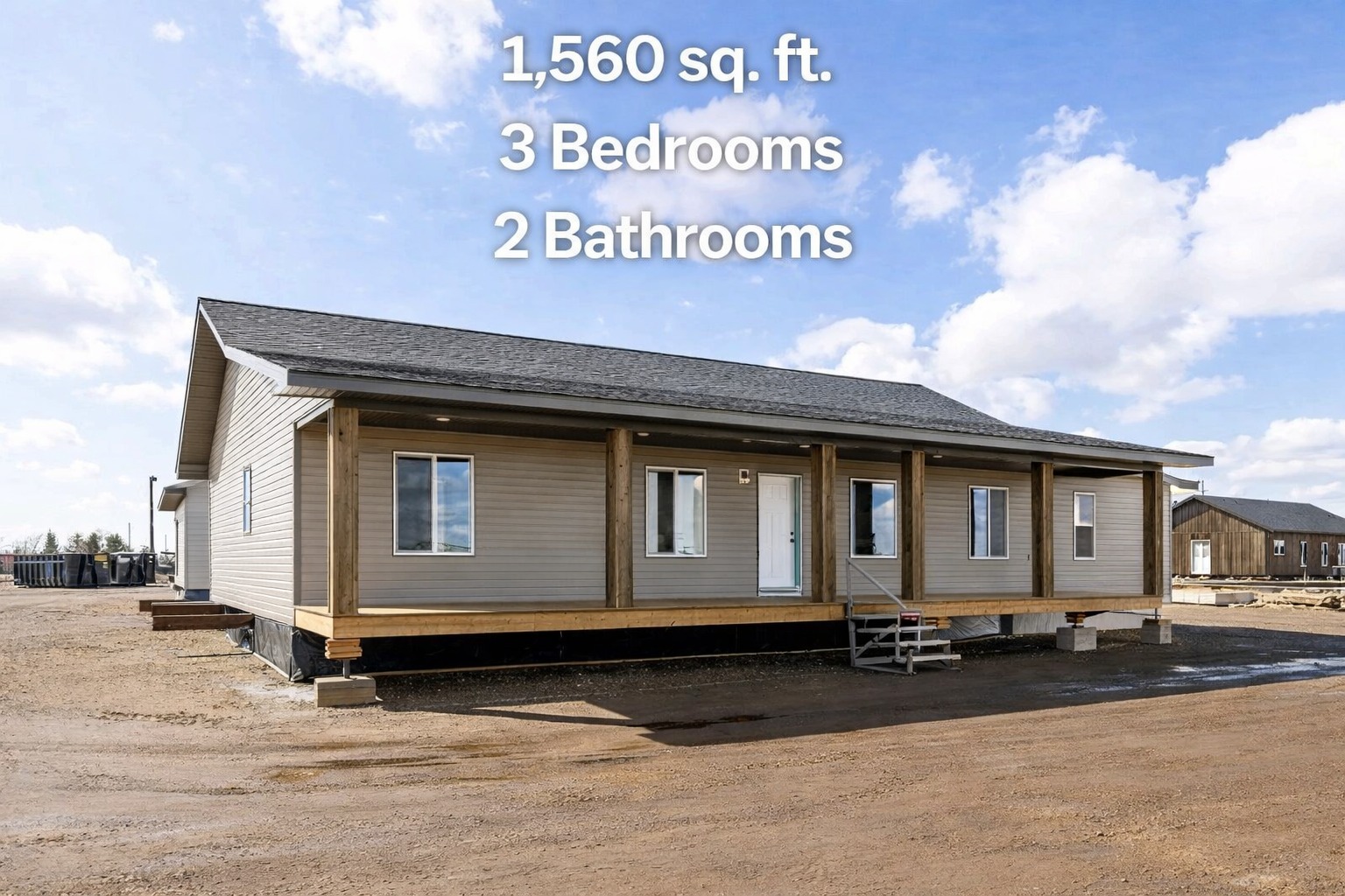 Single-story home with gray siding and a covered wooden porch under a blue sky. Text overlaid: "1,560 sq. ft., 3 Bedrooms, 2 Bathrooms."