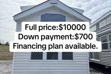 Front view of a small white house with a triangular roof against a cloudy sky. Text overlay states: "Full price: $10000, Down payment: $700, Financing plan available."