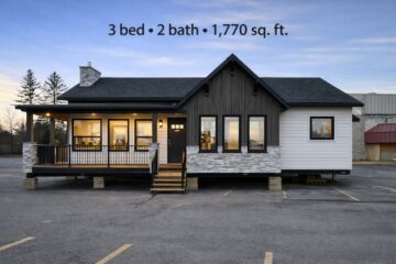 Single-story modern house with a mix of white siding and dark wood accents, featuring large windows. Text above reads "3 bed • 2 bath • 1,770 sq. ft." The setting is serene at sunset.
