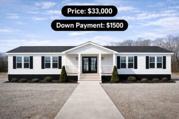A white, single-story house with black shutters is centered under a clear blue sky. Text above shows the price as $33,000 and down payment as $1,500.