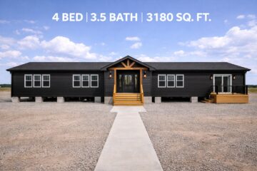 A modern black house with a gabled porch, large windows, and wooden steps, set in a barren landscape under a clear blue sky. Text above states "4 Bed | 3.5 Bath | 3180 Sq. Ft."