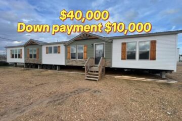 A modular home on a gravel lot with blue sky. Text reads "$40,000 Down payment $10,000" in bold yellow, conveying a sales offer.