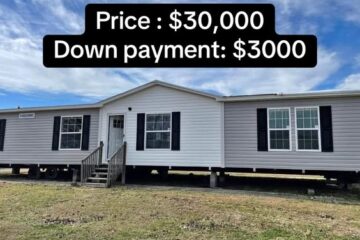 A white and gray mobile home with a gabled roof, featuring black shutters and multiple windows. Text overlay: "Price: $30,000, Down payment: $3,000."